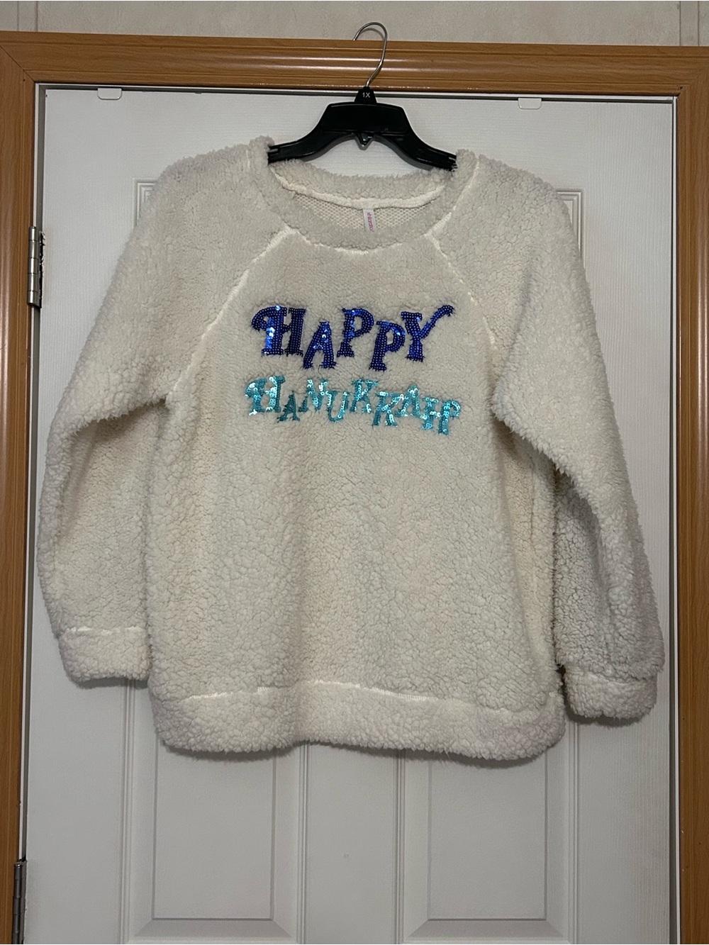 Cozy Cream Sherpa Sweater with 'Happy Hanukkah' Sequin Accent